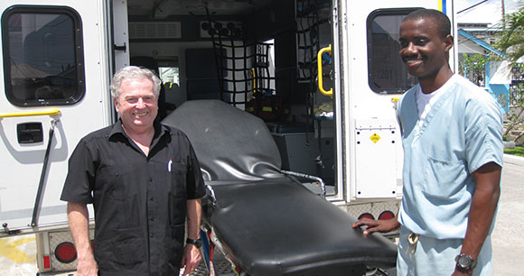 Charge d'Affaires of the High Commission of Canada with donated ambulance and Guyana EMS